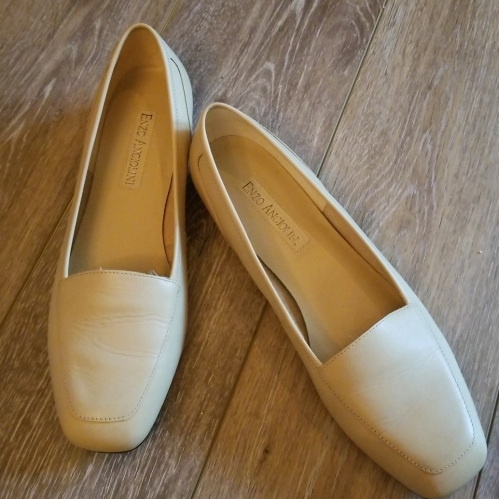 Barely broke in cream leather loafers.